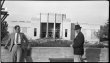 Two men in front of uncompleted Aquarium