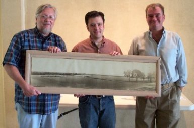 Steve Butler, David Fisher, and Eliot Greene holding WRL dam photo